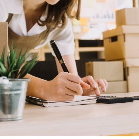 A small business owner working in their shop